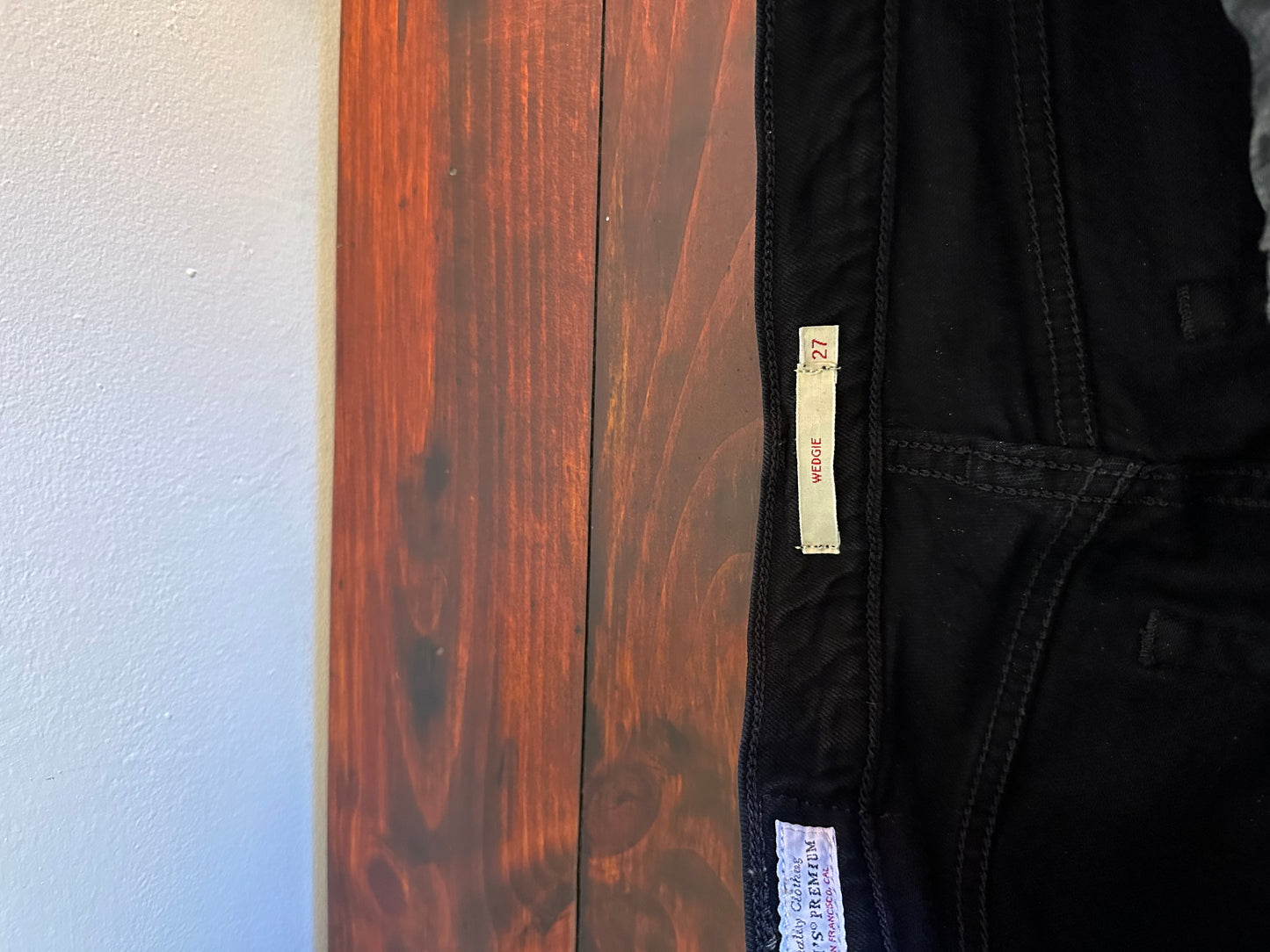 Levi's - Black Ripped and Distressed Wedgie Tapered Jeans with Raw Hem | Size 27