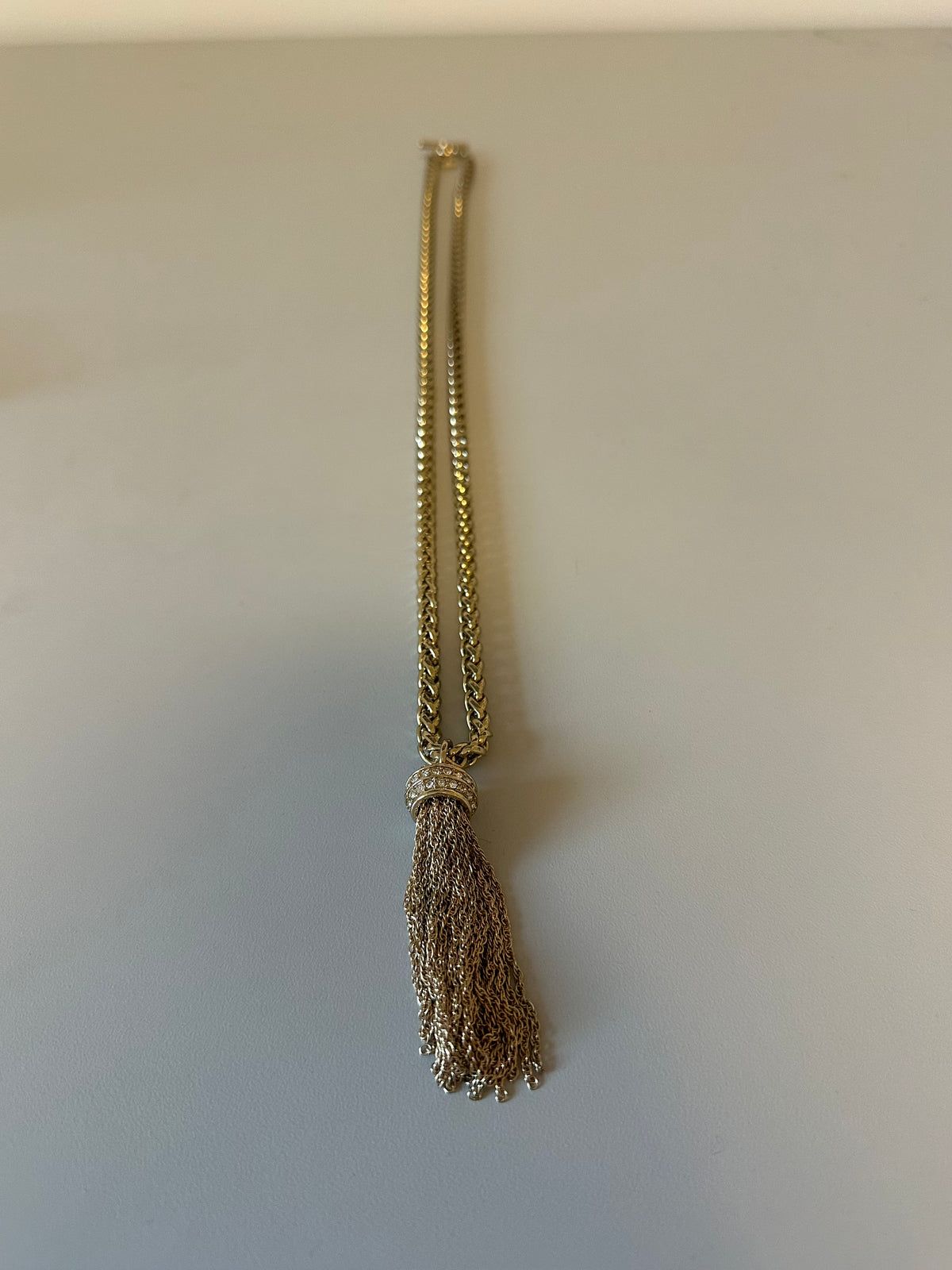 Gold Tone Wheat Chain Tassel Necklace with Pavé Crystal Accents and Toggle Clasp