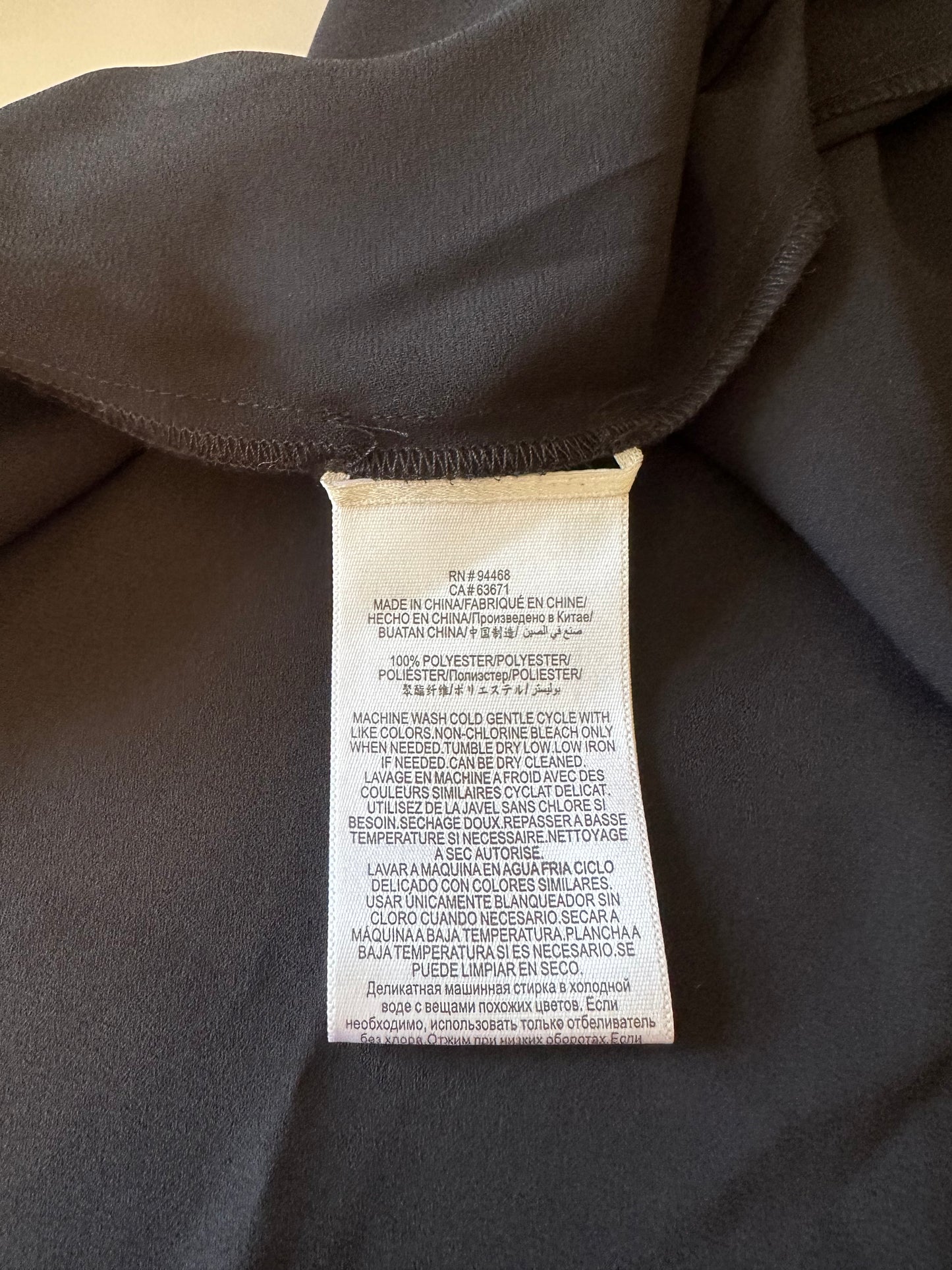 BCBGMAXAZRIA Asymmetrical Handkerchief Hem Sleeveless Blouse in Black | Size Small