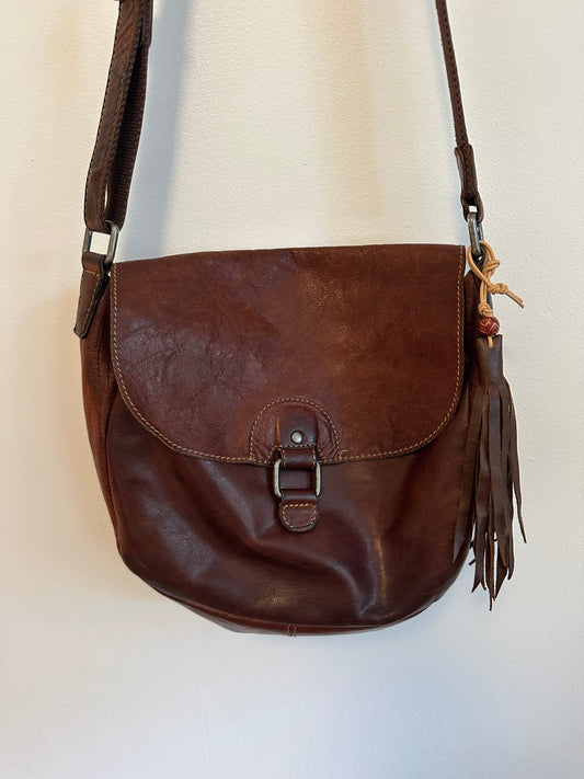 Brown Leather Crossbody Saddle Bag Tassel Accent and Adjustable Strap